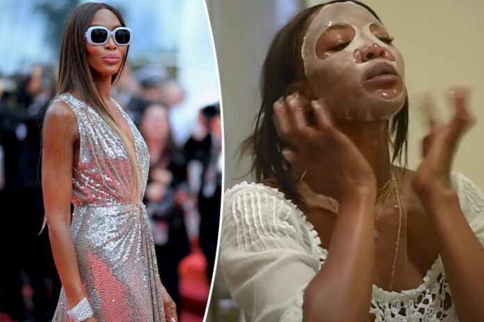 Naomi Campbell indossa una maschera di carta per la cura della pelle e occhiali da sole a Cannes
